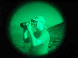 Sen. Kent Lambert using night vision scope on the Mexican border.