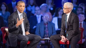 President Barack Obama, left, speaks during a CNN televised town hall meeting hosted by Anderson Cooper, right, at George Mason University in Fairfax, Va., Thursday, Jan. 7, 2016. Obama's proposals to tighten gun controls rules may not accomplish his goal of keeping guns out of the hands of would-be criminals and those who aren't legally allowed to buy a weapon. In short, that's because the conditions he is changing by executive action are murkier than he made them out to be. (AP Photo/Pablo Martinez Monsivais)