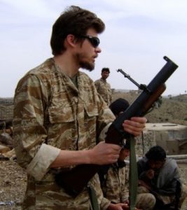 Jon Keyser holds an M-79 "blooper" grenade launcher in Afghanistan.